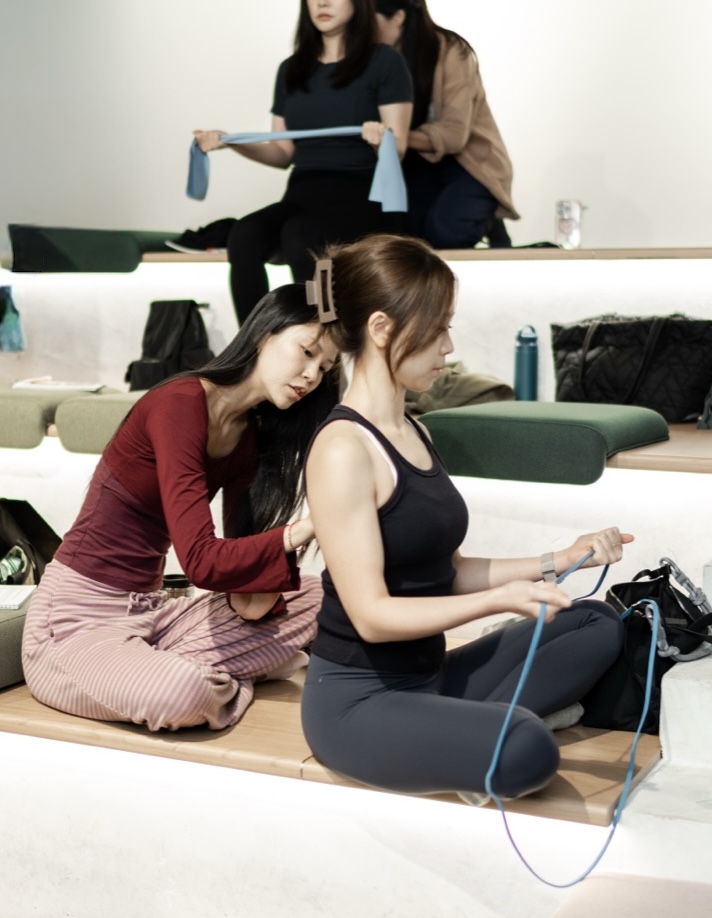 Cohort 1 instructors practising assessment techniques on each other between sessions